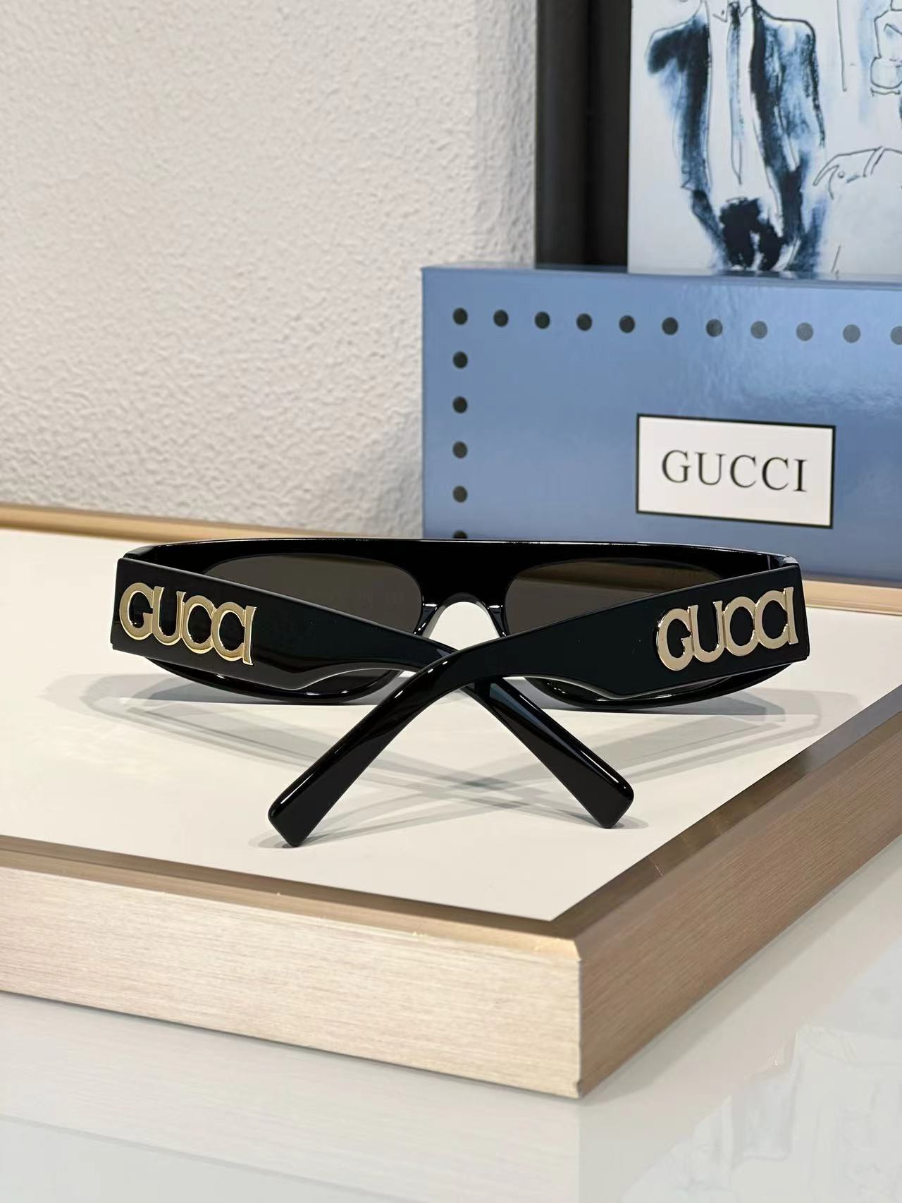 G*u*i sunglasses