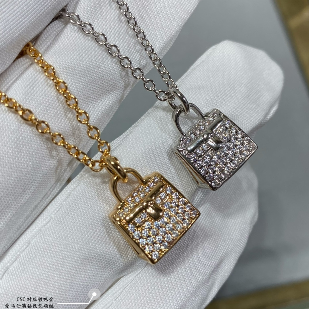 H**me5 fully di*m*nd-encrusted bag necklace