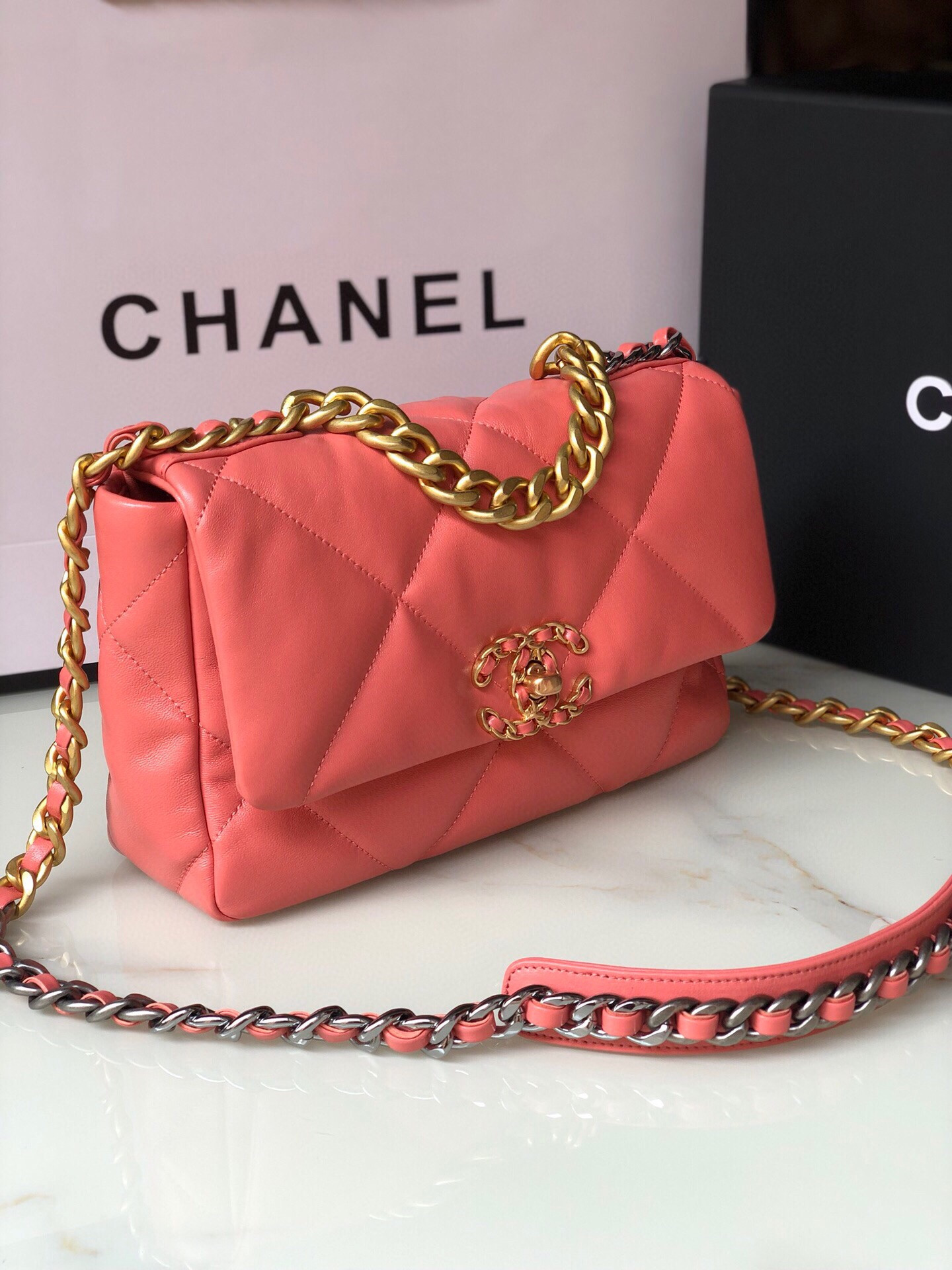 Ch*el 19 handbag shiny pink gold-tone, silver-tone & ruthenium-finish metal 6.2 × 10.1 × 3.5 in