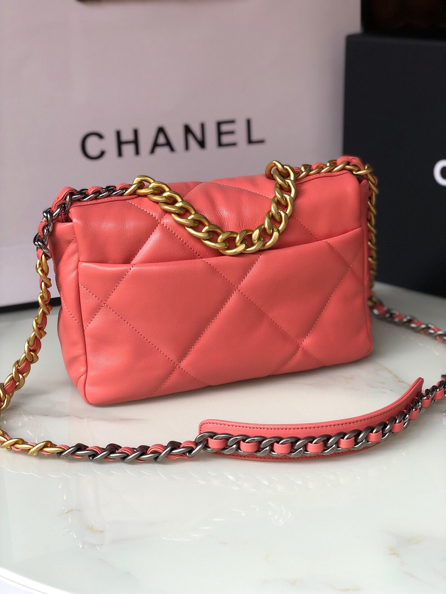 Ch*el 19 handbag shiny pink gold-tone, silver-tone & ruthenium-finish metal 6.2 × 10.1 × 3.5 in
