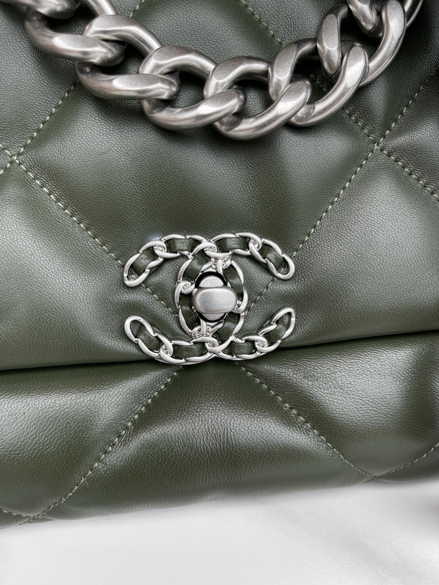 Ch*el 19 large handbag shiny leather, gold-tone, silver-tone & ruthenium-finish metal dark green 7.8 × 11.7 × 3.9 in