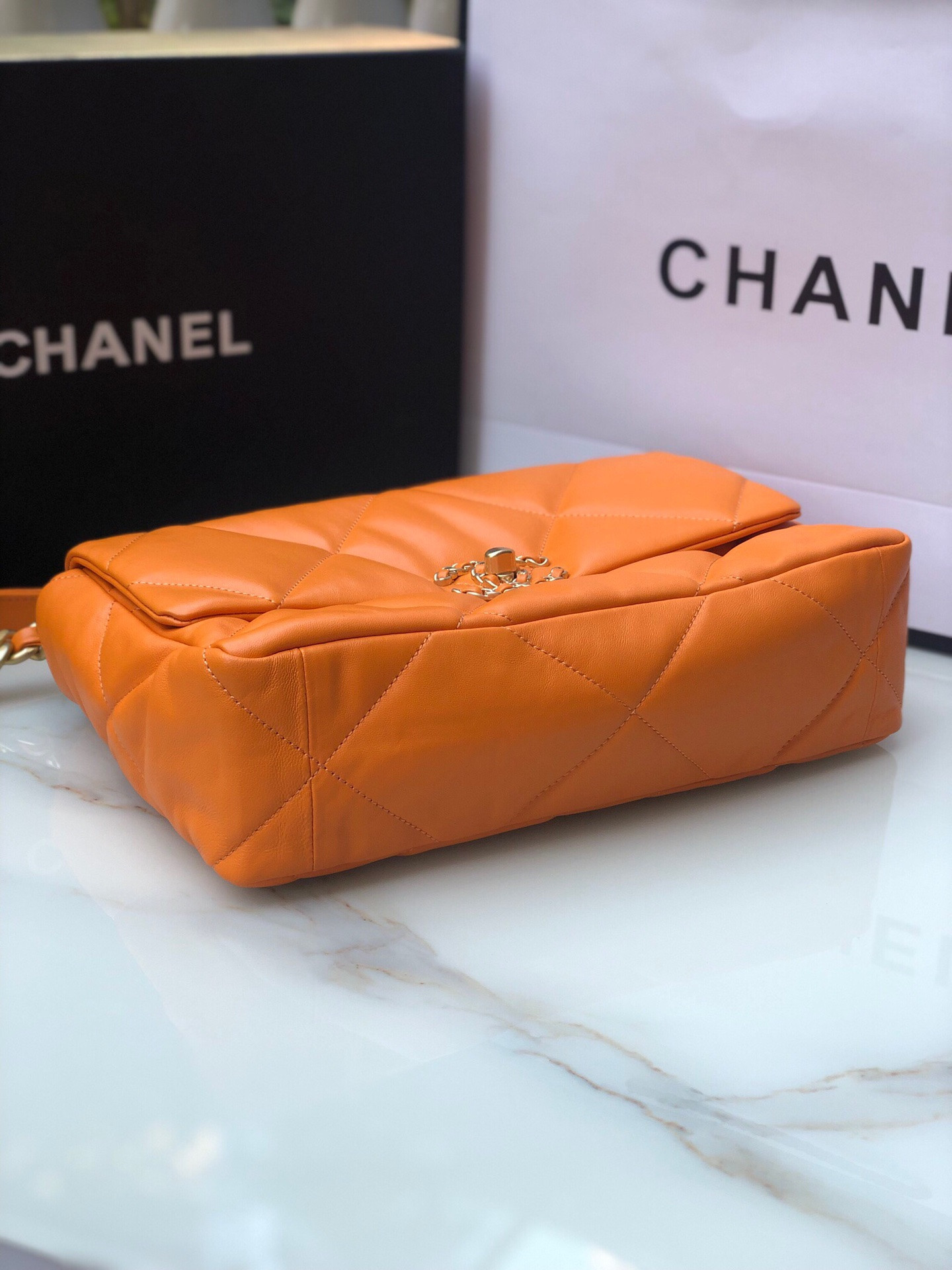 Ch*el 19 large handbag shiny leather, gold-tone, silver-tone & ruthenium-finish metal orange 7.8 × 11.7 × 3.9 in