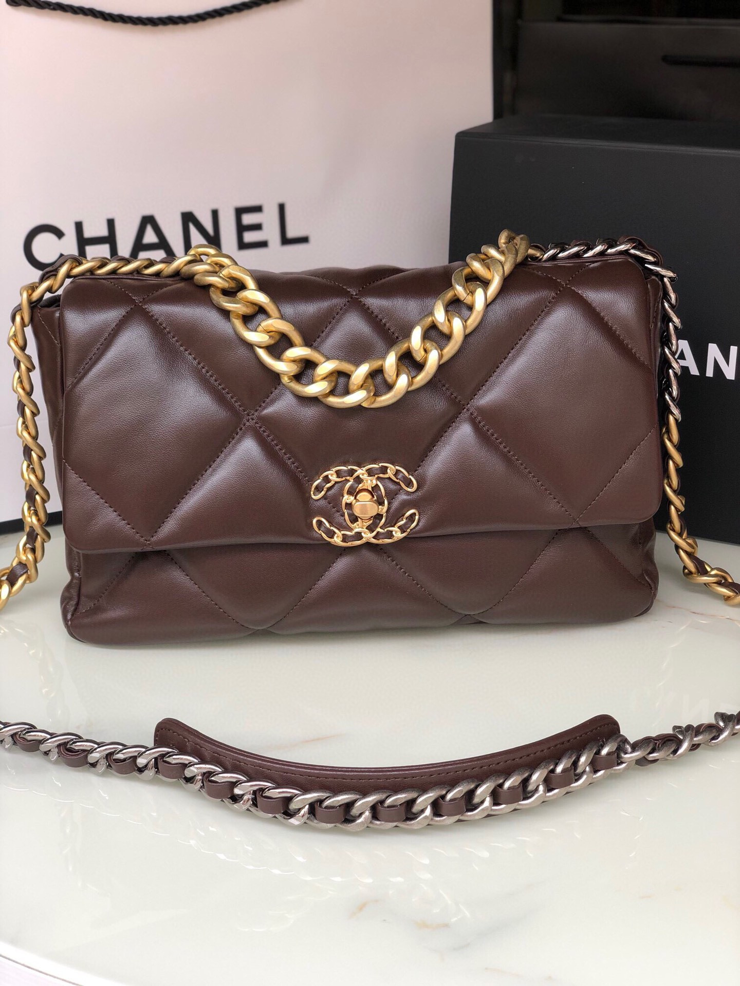 Ch*el 19 large handbag shiny leather, gold-tone, silver-tone & ruthenium-finish metal brown 7.8 × 11.7 × 3.9 in