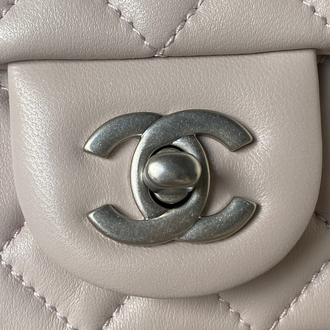 Ch*el mini flap bag shiny calfskin & silver-tone metal light pink 4.7 × 7.8 × 2.3 in