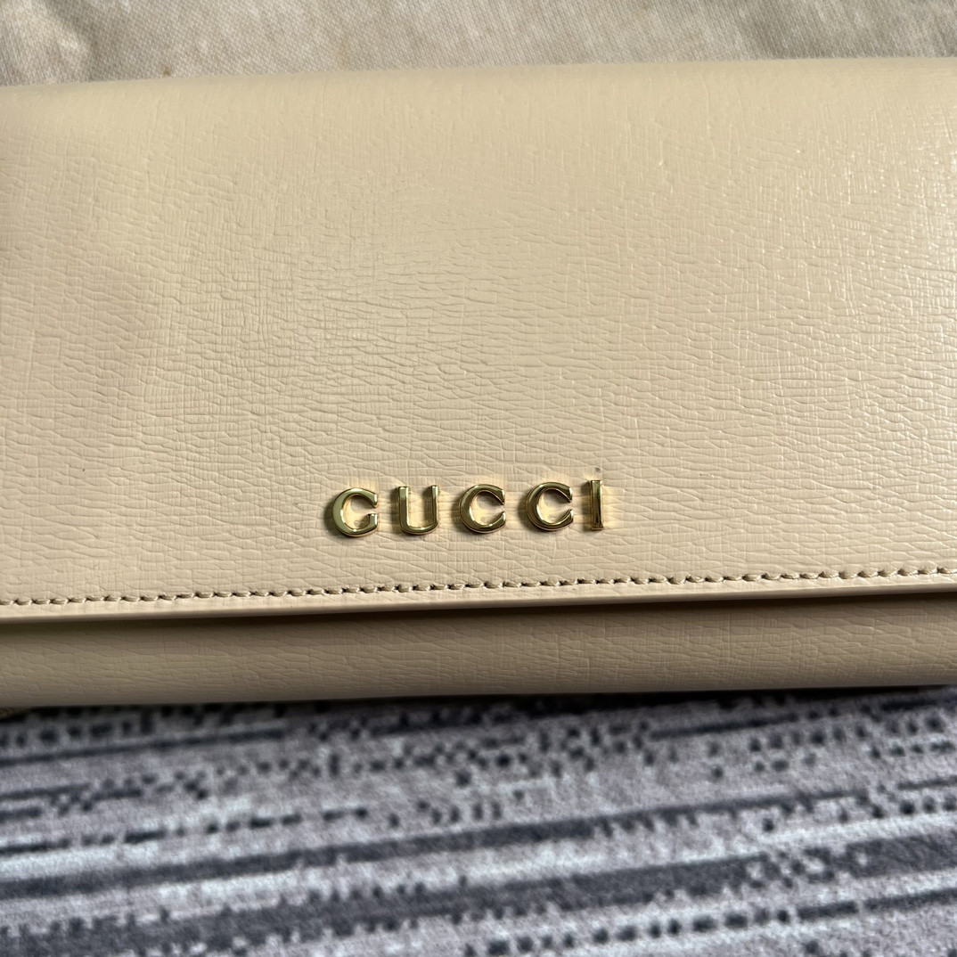 continental wallet with G*u*i script light yellow 7.5"w x 4"h x 1.4"d