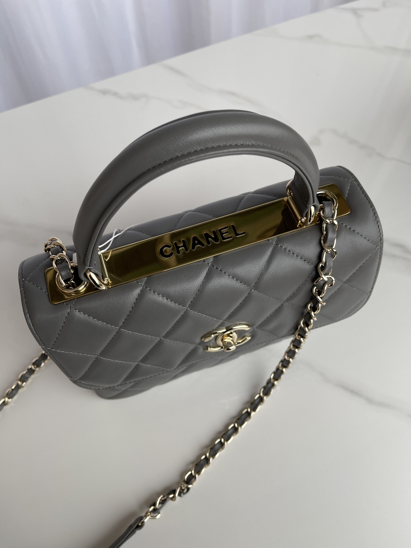 Ch*el flap bag with top handle 6.6 × 9.8 × 4.7 in