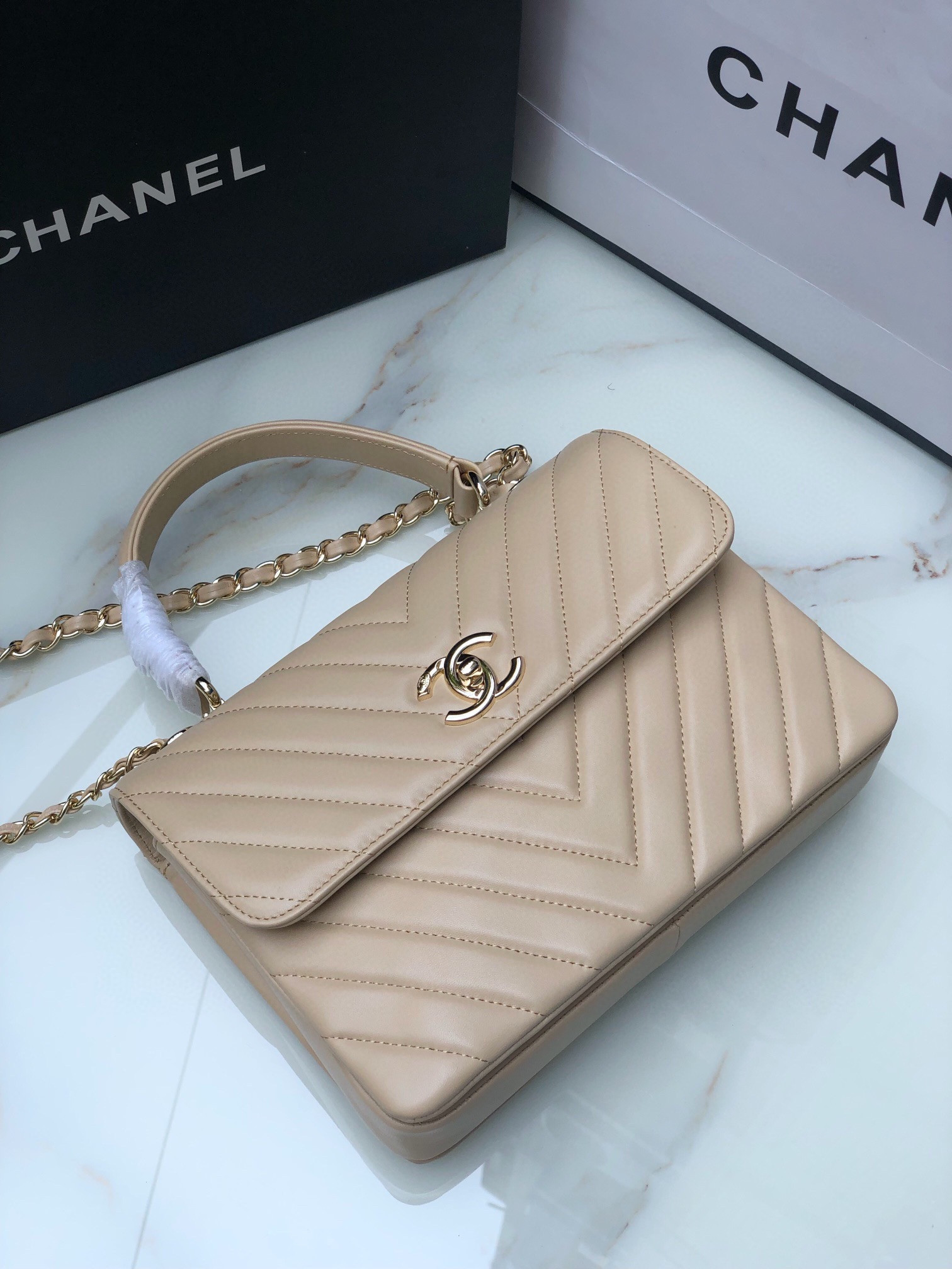 Ch*el flap bag with top handle beige 6.6 × 9.8 × 4.7 in