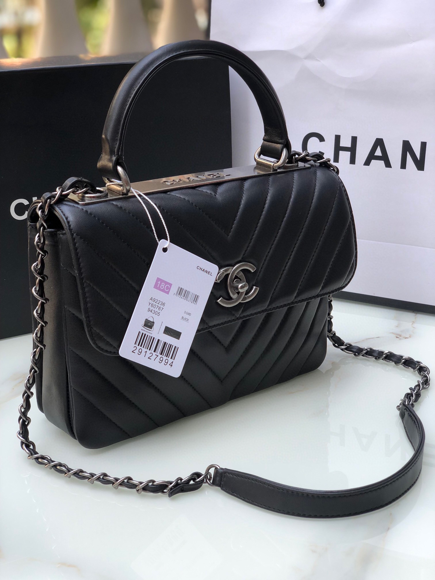 Ch*el flap bag with top handle 6.6 × 9.8 × 4.7 in