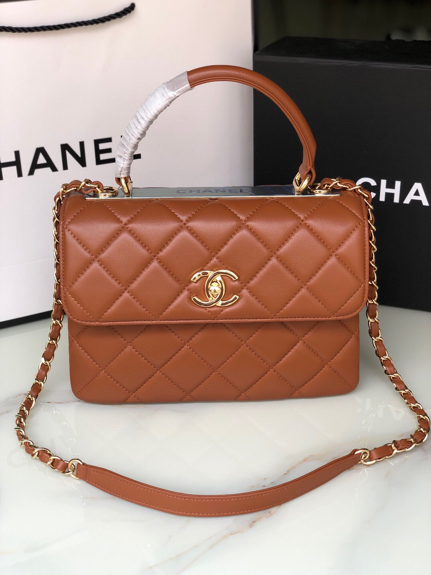 Ch*el flap bag with top handle 6.6 × 9.8 × 4.7 in
