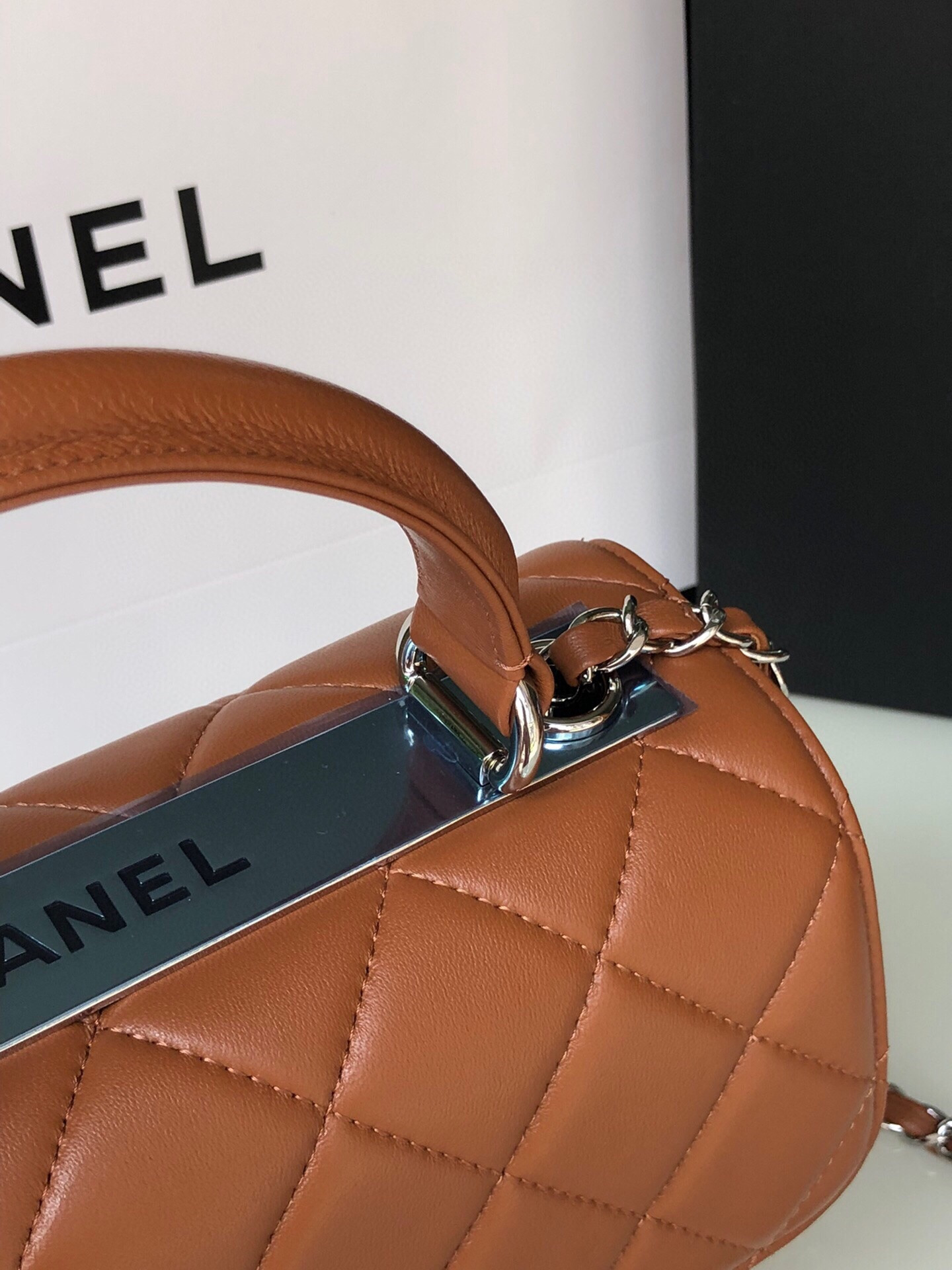 Ch*el flap bag with top handle 6.6 × 9.8 × 4.7 in