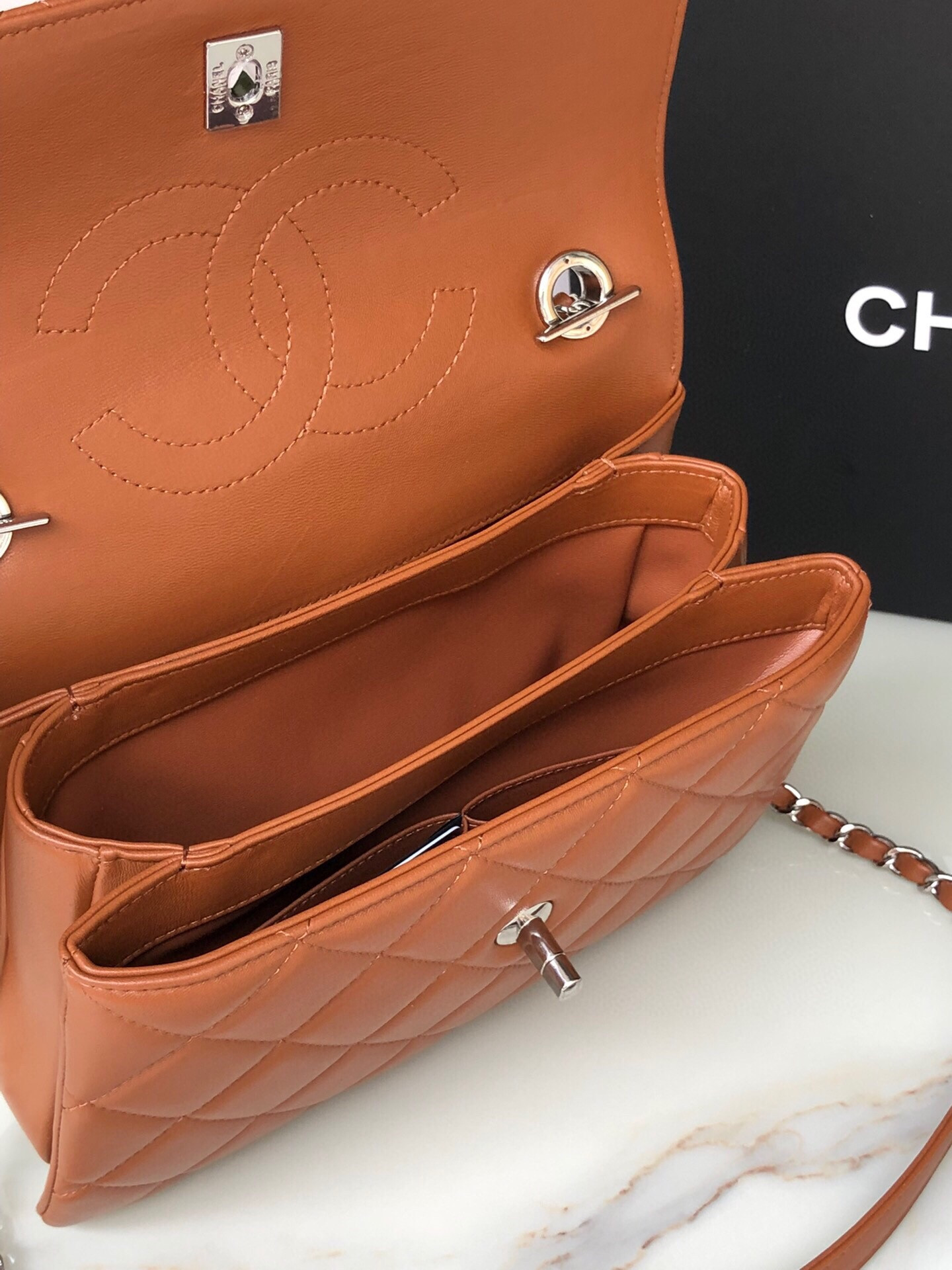 Ch*el flap bag with top handle 6.6 × 9.8 × 4.7 in