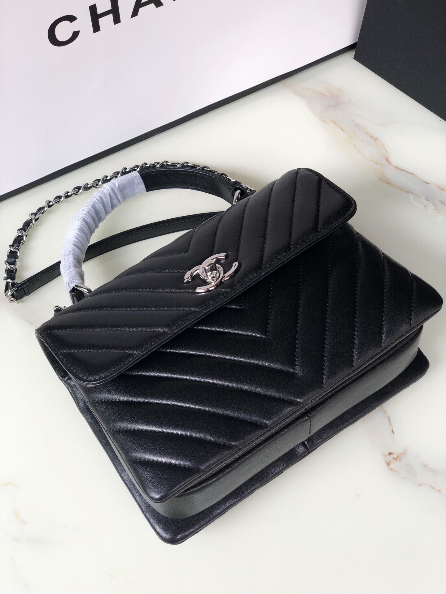 Ch*el flap bag with top handle 6.6 × 9.8 × 4.7 in