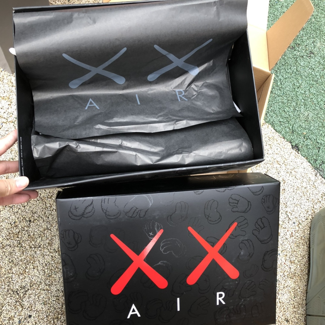 UA Jordan 4 Retro Kaws Black